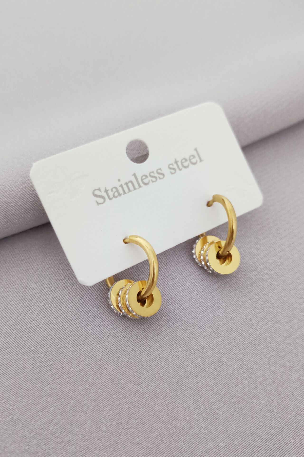 Çelik taşlı küpe gold