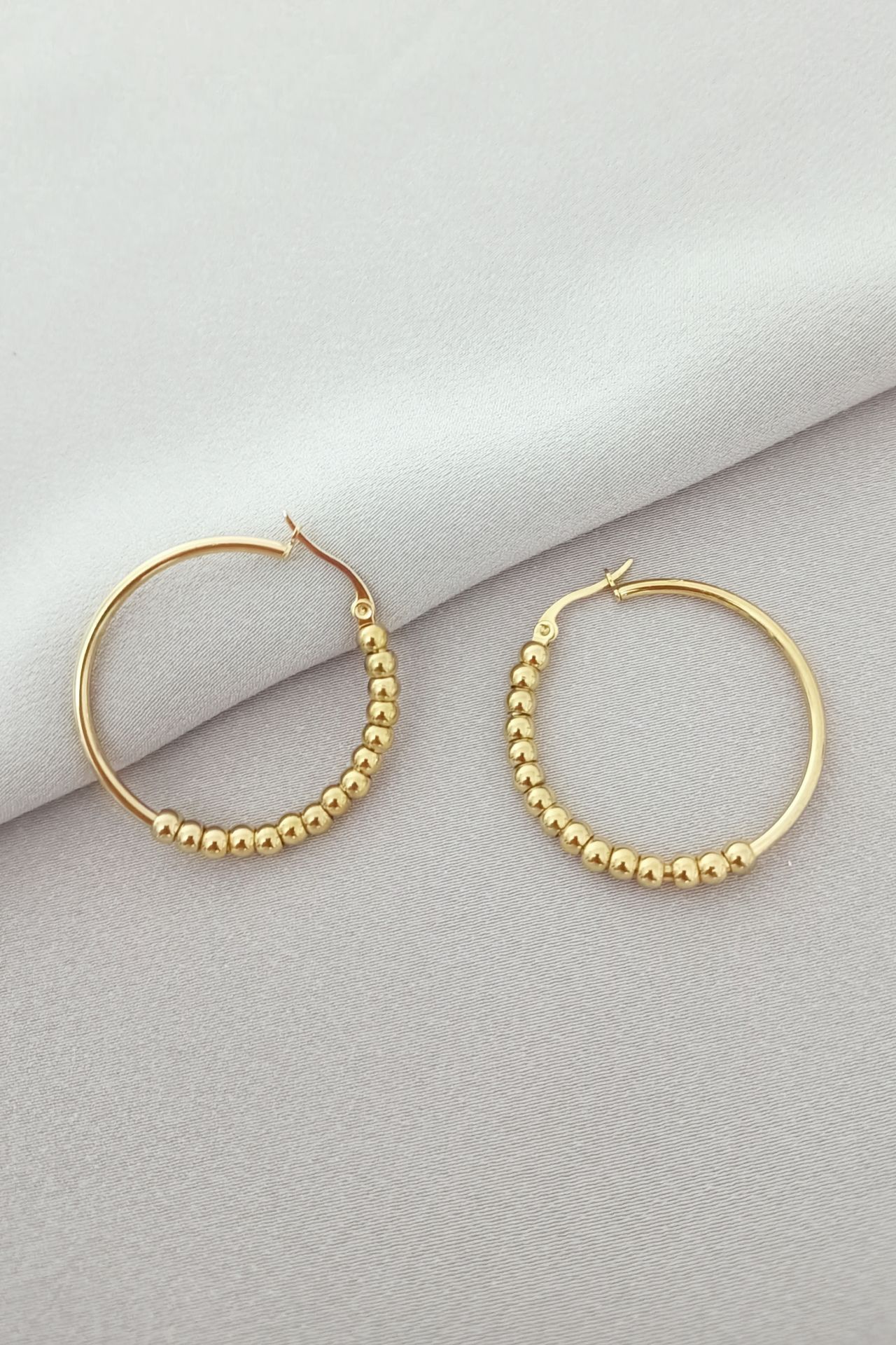 Çelik dorikalı gold küpe